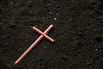 front view of cross on soil grim reaper funeral death evil devil
