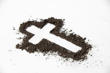 front view of cross shape with dark soil on white surface soil grim reaper funeral death