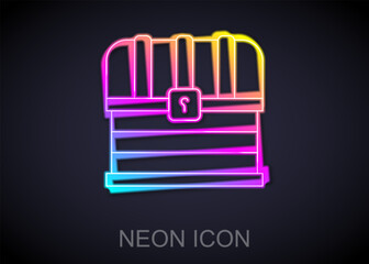 Glowing neon line Antique treasure chest icon isolated on black background. Vintage wooden chest with golden coin. Vector