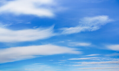 Bright blue sky with fine cirrus clouds