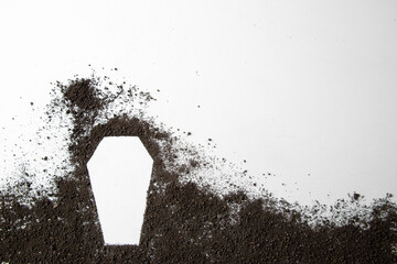 top view of coffin shape with dark soil on a white background grim reaper funeral death