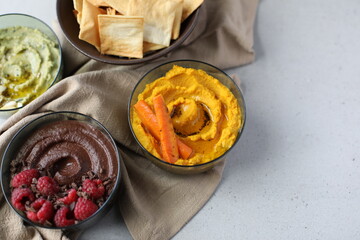 Savory Roasted Carrot Hummus and Sweet Chocolate Hummus with Raspberries 