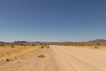 Fototapeta na wymiar scenic view of an empty gravel road in Namibia