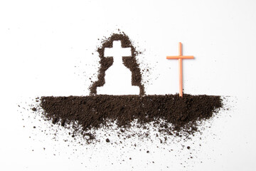 top view of cross shape with dark soil on a white surface grim reaper death funeral