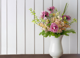 spring flower assortment in white vase in front of white wooden boarded wall, copy space, pastel colors, mother's day, valentines day, wedding, birthday