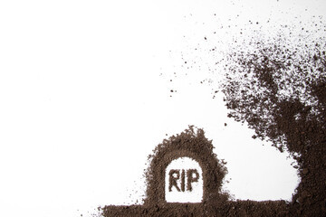 top view of grave shape with rip inscription and soil on white surface funeral grim reaper death