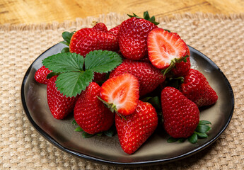 New harvest, board with fresh ripe red sweet Spanish strawberry