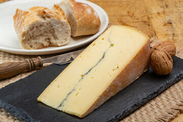 Cheese collection, French Morbier semi-soft cow milk cheese with black mold layer