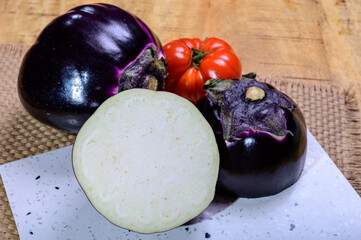 Fresh ripe sicilian purple globe Violetta eggplants vegetables ready to cook, healthy Italian food