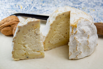 Cheese collection, soft cow French cheese with mold Gaperon artisanal lavored with cracked peppercorns and garlic produced in Auvergne