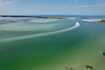 Fototapeta na wymiar An aerial drone view of Caladesi Island, Dunedin, Florida, beautiful white beaches, and blue, green waters of the Gulf of Mexico.