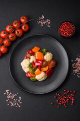 Delicious salad of fresh cherry tomatoes, sweet peppers, broccoli and cauliflower