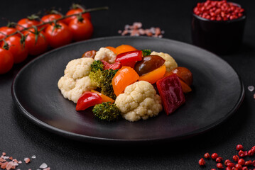 Delicious salad of fresh cherry tomatoes, sweet peppers, broccoli and cauliflower