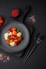 Delicious salad of fresh cherry tomatoes, sweet peppers, broccoli and cauliflower