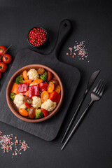 Delicious salad of fresh cherry tomatoes, sweet peppers, broccoli and cauliflower
