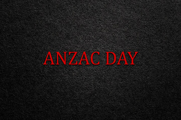 Text Anzac Day on black textured background. Anzac Day in New Zealand, Australia, Canada and Great Britain. Banner.