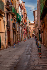 Narrow streets with shops and cafes old town Tarragona Costa Dorada Catalonia Spain