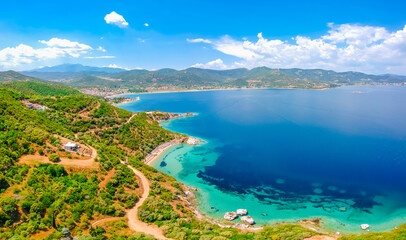 Obraz premium Aerial view of sand beach and blue water near Kavala, Greece, Europe