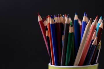 assorted coloured pencils in a pencil holder no people stock image stock photo