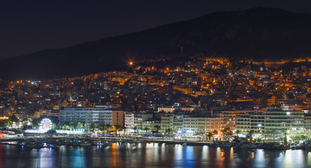 Fototapeta premium Cityscape and sea in Kavala city, Macedonia, Greece, Europe at night