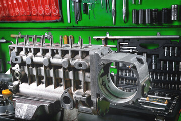 car fuel pump repair, truck fuel pump housing on workbench in service, repair tools and workbench...