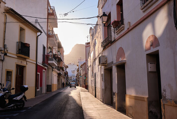 Fototapeta na wymiar View of colorful buildings and narrow streets, architecture in the historic center of the Mediterranean town of Calpe. Region Valencia in Spain