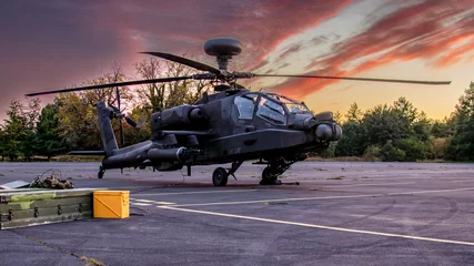 Tuinposter Apache military attack helicopter on the ground. Forward landing ground. © Robert L Parker