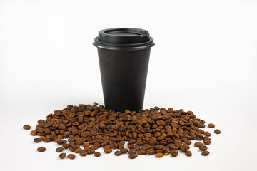 Black paper coffee cup with lid and coffee beans isolated on white background. A cup for a takeaway fast food cafe.