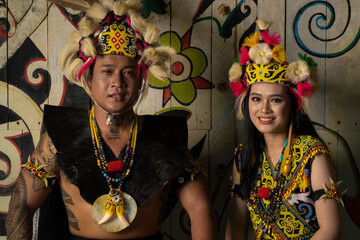 A Borneo couple showcasing the beauty of her culture through stunning traditional clothing