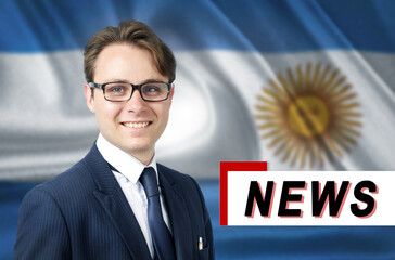 News anchor, tells the latest news, smiling, against the background of the flag of Argentina.