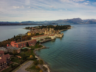 Fototapeta na wymiar Aerial vIew by drone. Summer. Sirmione, Italia. Lago di Garda. Lake. Castle.