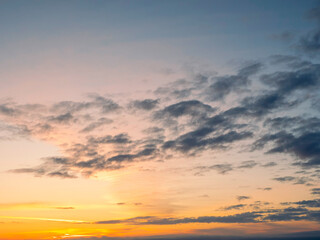 Stunning sun rise sky with clouds. Warm and cool color. Background for design and sky replacement.