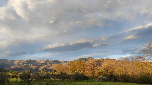 Beautiful cloudscape above the Pratomagno mountain ridge in Tuscany, Italy. Real time pan.