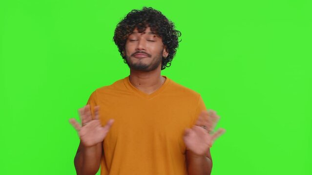 I am dont want it, not me. Confused young indian man pointing fingers hisself ask say who why me no thanks i do not need it, rejection, refusal, stop sign. Hindu guy isolated on chroma key background