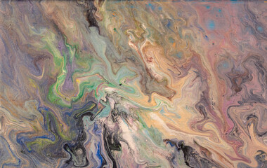 Creative multicolored acrylic paint pouring, fluid art background with abstract painted waves