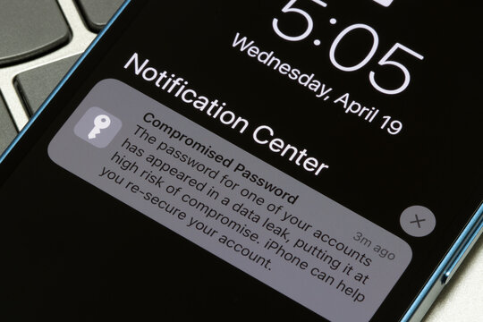 Portland, OR, USA - Apr 19, 2023: Closeup of the Compromised Password notification seen on an iPhone's lock screen. Data breach concept.