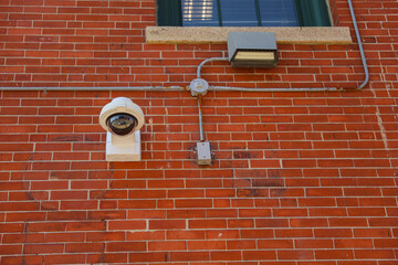 security camera in the image represents the use of technology for safety and protection. It symbolizes surveillance and monitoring as a means of preventing crime and detecting security breaches