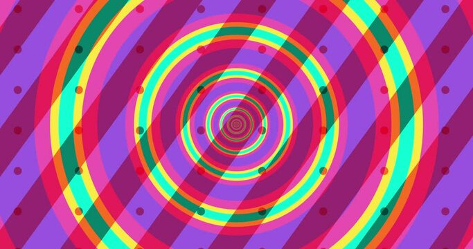 Flying through optical illusion of circles creating abstract tunnel. Pink, green, and purple spectrum. Modern colorful 4k seamless loop animation.