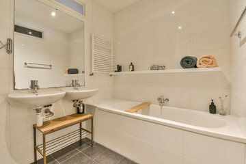 a bathroom with a sink, mirror and towel rack on the wall next to the bathtub in the corner