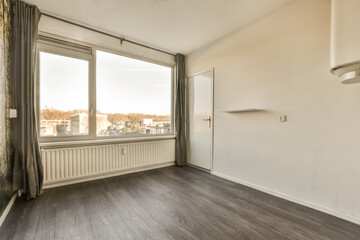 an empty room with wood flooring and large windows looking out onto the cityscapearrons com