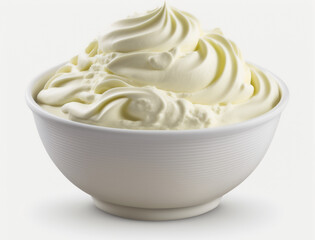 A bowl of sour cream sits on a white background.