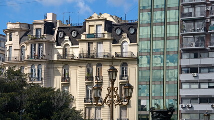 Old apartment building beside modern buidlings on July 9th Avenue in Buenos Aires, Argentina