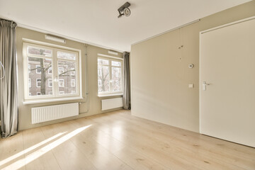 an empty living room with wood flooring and large windows in the room is very clean, but it's no longer than