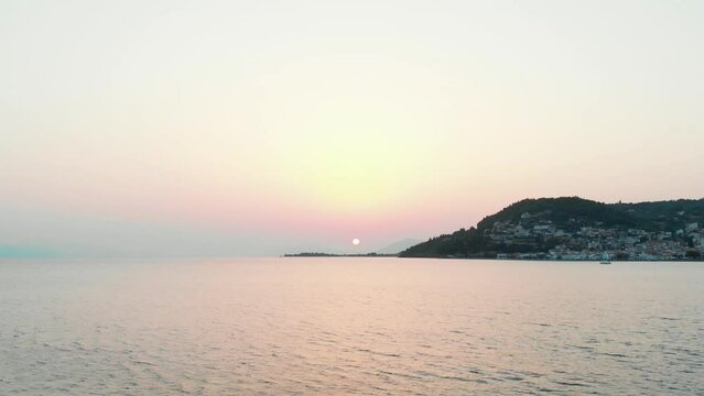 Pink sunset over a bay in Evia Greece