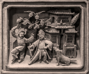 Close-up of wooden figures carved on old buildings in ancient China