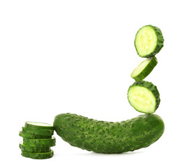 Cut and whole fresh cucumbers isolated on white