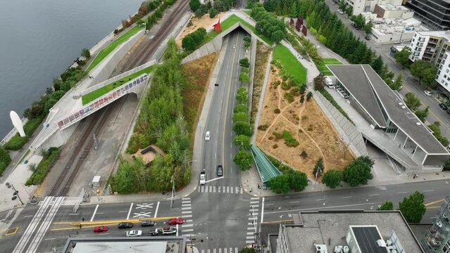 Drone shot of Seattle's downtown Sculpture Park, cars driving on Elliott Ave.