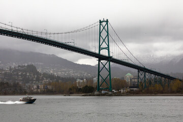  The Lion's Gate Bridge is seen from the seawall trail in Stanley Park in Vancouver, British Columbia, Canada. The trail round the park is popular city destination for locals and tourists alike
