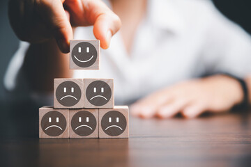Customer service evaluation and satisfaction survey concepts. The client's hand picked the happy...