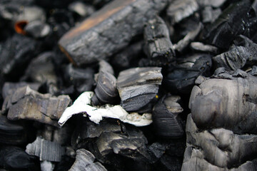 charcoal for cooking meat and vegetables, closeup of black coal                            